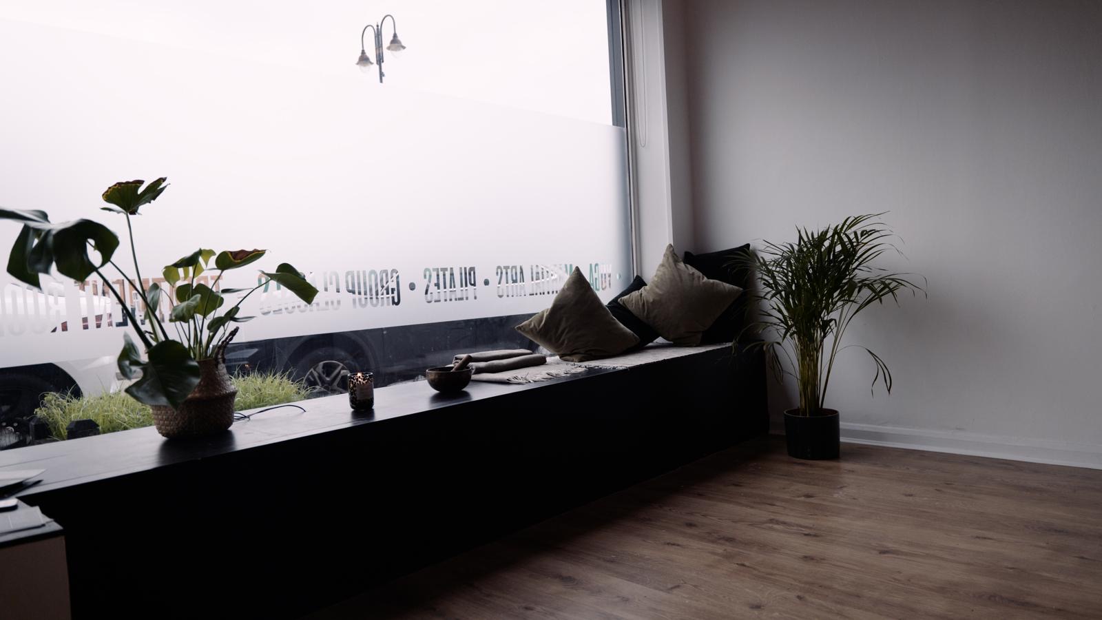 The window seat at Bushido Studio, with cushions and plants