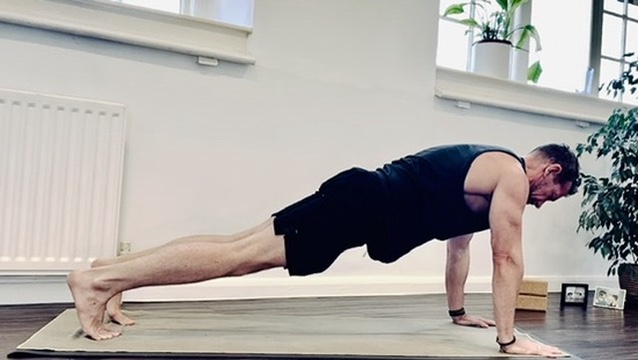 Plank on the mat at the studio